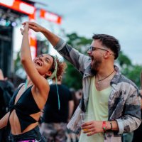 dancing couple at concert - concert stock pictures, royalty-free photos & images