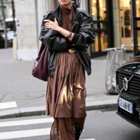 Dara is seen wearing a sheer brown top, brown skirt, brown pants, black boots outside the Vetements show during the Womenswear Fall/Winter 2024/2025...