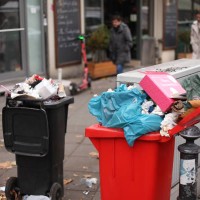 December 2022, Berlin: , Berlin. Garbage pours out of trash cans near the Rathaus Steglitz S-Bahn station after a market event. Photo: Wolfram...