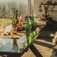 decorated autumn garden table with beer bottles - garden decoration stock pictures, royalty-free photos & images