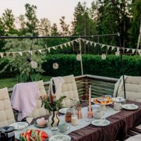 decorated patio with food and drinks arranged on table - garden decoration stock pictures, royalty-free photos & images