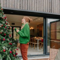 decorating my outdoor christmas tree - garden decoration stock pictures, royalty-free photos & images