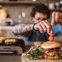 decorating tasty hamburgers - junk food stock pictures, royalty-free photos & images