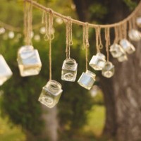 decoration jars hanging from trees in a park - garden decoration stock pictures, royalty-free photos & images