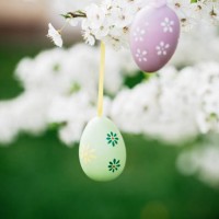 decorative easter egg hanging on flowering tree. easter background. family celebration, christian traditions. holiday greeting card template. - garden decoration stock pictures, royalty-free photos & images