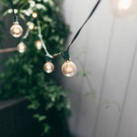 decorative party lights in backyard - garden decoration stock pictures, royalty-free photos & images