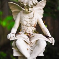 decorative statue in a home garden, fredericton, new brunswick, canada - garden decoration stock pictures, royalty-free photos & images