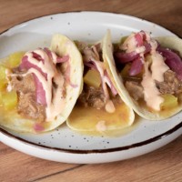 delicious tacos al pastor with pineapple and red onion on a plate - junk food stock pictures, royalty-free photos & images