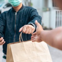 delivering food at your doorstep keeping social distancing during covid-19 outbreak - food stock pictures, royalty-free photos & images