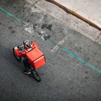 delivering food on bicycle in city - food stock pictures, royalty-free photos & images