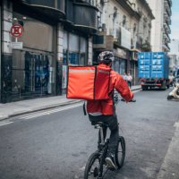 delivery boy on bicycle in city - food stock pictures, royalty-free photos & images