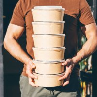 delivery man picking up take away food order. - junk food stock pictures, royalty-free photos & images