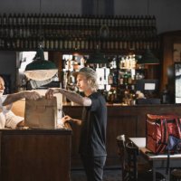 delivery person receiving order in a restaurant - junk food stock pictures, royalty-free photos & images