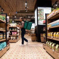 delivery person selecting products at the supermarket - junk food stock pictures, royalty-free photos & images