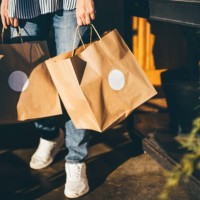 delivery woman picking up take away food order. - junk food stock pictures, royalty-free photos & images
