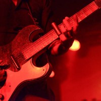 detail of man playing guitar on stage with a silde - concert stock pictures, royalty-free photos & images