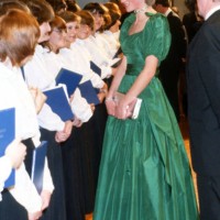 Diana, Princess of Wales, wearing an emerald green taffeta evening gown designed by Graham Wren, meets performers as she attends a gala concert at...