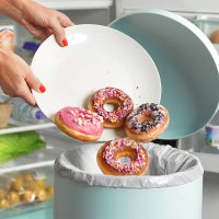 dieter throwing away donuts - junk food stock pictures, royalty-free photos & images