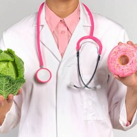 dietician with healthy and unhealthy food - junk food stock pictures, royalty-free photos & images