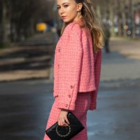 Digital influencer Lyna Zerrouki wears all Chanel with a black bow in her hair on March 03, 2020 in Paris, France.