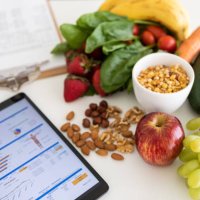 digital nutritional program with heathy food and digital tablet charts - food stock pictures, royalty-free photos & images