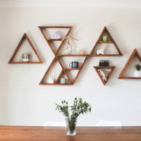 dining room area with triangle shelves as wall decor - home decoration stock pictures, royalty-free photos & images