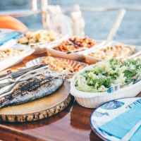 dinner on sailboat. - food stock pictures, royalty-free photos & images