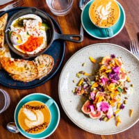 directly above view of breakfast with fig toast and poached eggs in a skillet - food stock pictures, royalty-free photos & images