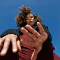 directly below portrait of woman against blue sky - fashion stock pictures, royalty-free photos & images