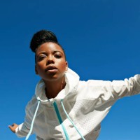 directly below shot of female athlete wearing white jacket against clear blue sky - fashion stock pictures, royalty-free photos & images