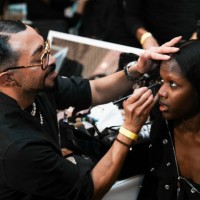 Director of Makeup for MAC Cosmetics, Romero Jennings, prepares a model backstage at the Kim Shui fashion show during 2025 New York Fashion Week on...