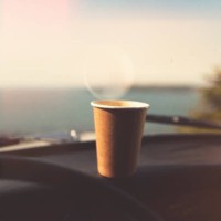 disposable paper coffee cup on dashboard - junk food stock pictures, royalty-free photos & images
