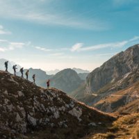 diverse friends enjoying sunny mountain hike - travel stock-fotos und bilder