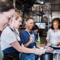 diverse group of volunteers working at the warehouse - food stock pictures, royalty-free photos & images