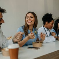 doctors and nurses bonding over lunch - junk food stock pictures, royalty-free photos & images