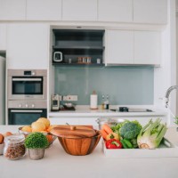domestic kitchen with fruits and vegetables on kitchen counter - food stock pictures, royalty-free photos & images