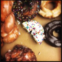 donuts eaten - junk food stock-fotos und bilder