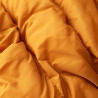 down jacket fabric background, orange puffer jacket texture - fashion stock pictures, royalty-free photos & images