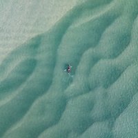 drone image looking down on a kayaker in the noosa river, queensland, australia - travel stock pictures, royalty-free photos & images