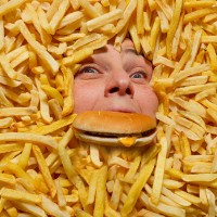 drowning in junk food - food stock pictures, royalty-free photos & images