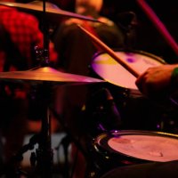 drummer performing on stage with band - concert stock pictures, royalty-free photos & images