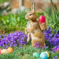 easter bunny in garden with flowers - garden decoration stock pictures, royalty-free photos & images