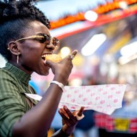 eating at the fair - food stockfoto's en -beelden
