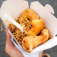 eating chinese food from takeaway box on the street, personal perspective - junk food stock pictures, royalty-free photos & images
