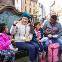 eating chips in the town centre - junk food stock pictures, royalty-free photos & images