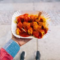 eating currywurst from personal perspective point of view - junk food stock pictures, royalty-free photos & images