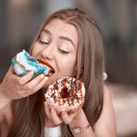 eating delicious donuts - junk food stock pictures, royalty-free photos & images