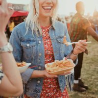 eating food at a festival - food stock pictures, royalty-free photos & images