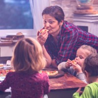 eating homemade pizza at home - junk food stock pictures, royalty-free photos & images