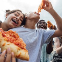 eating pizza and funny faces - junk food stock pictures, royalty-free photos & images